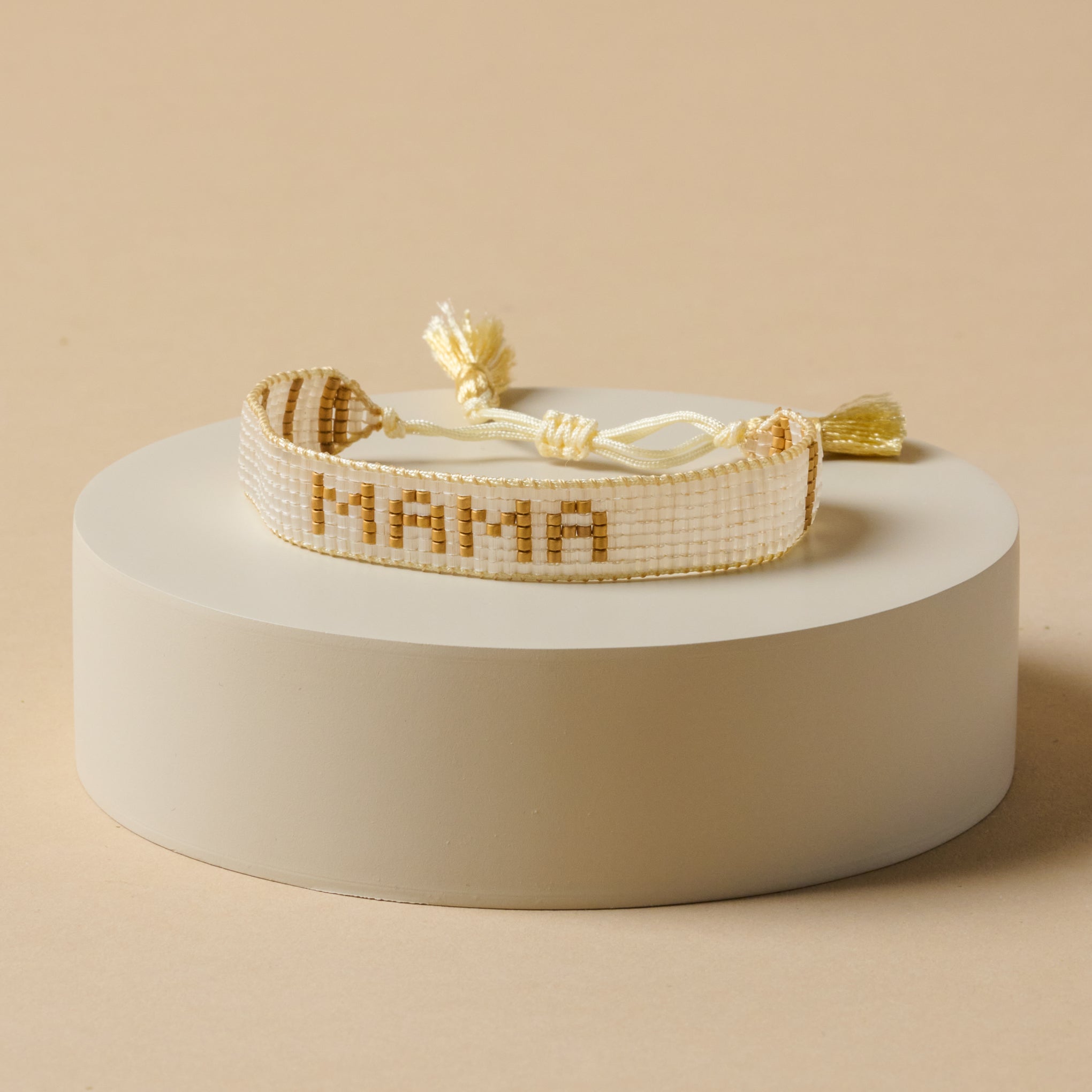 White and gold mama beaded bracelet 