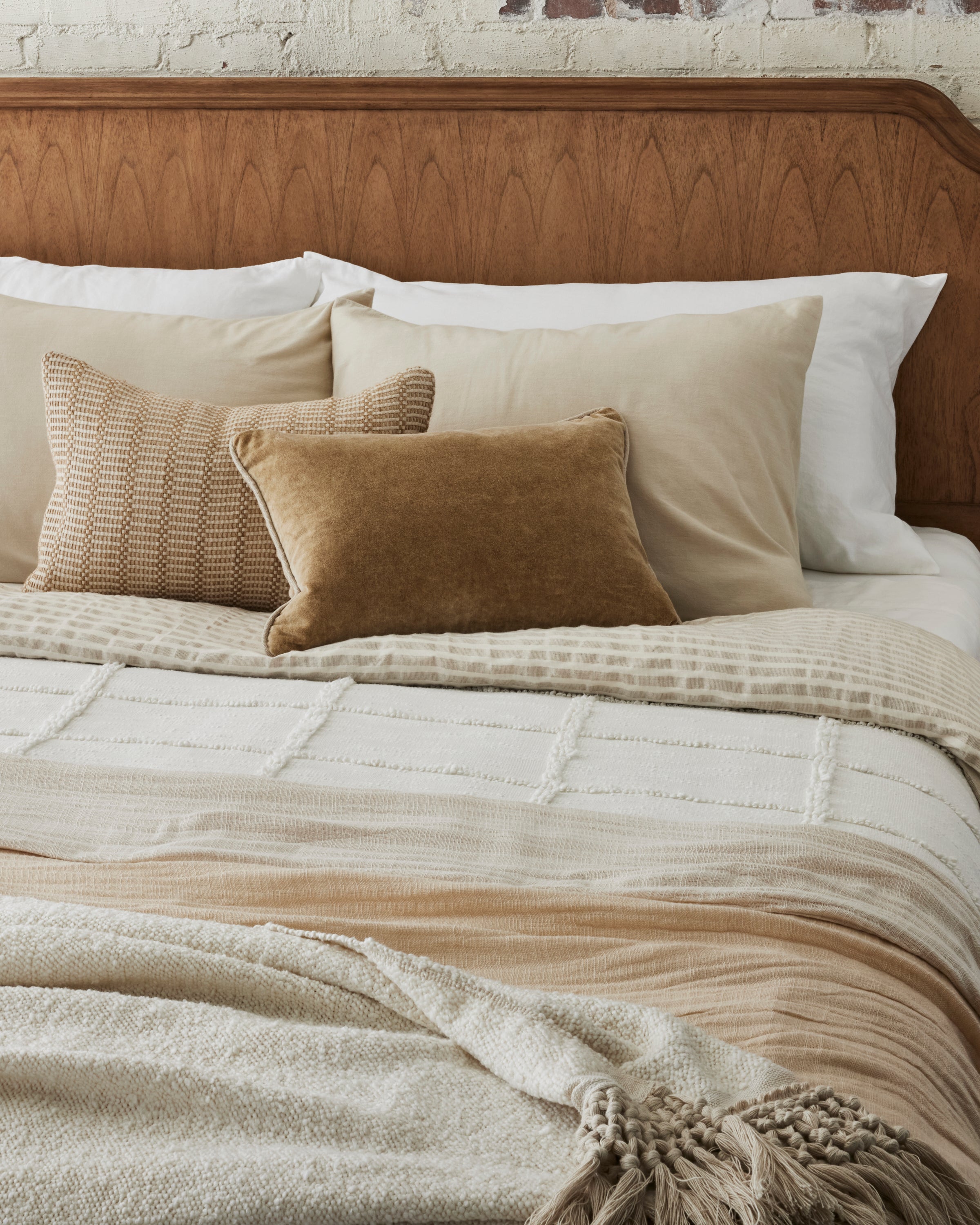 Angora + Oatmeal Stripe Linen Cotton Duvet on a made bed