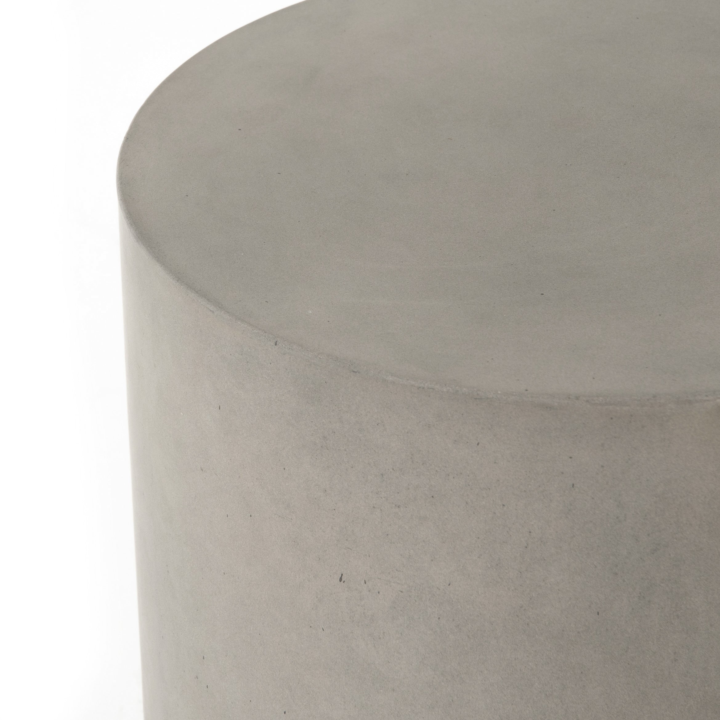 modern grey cylindrical end table with plaster finish
