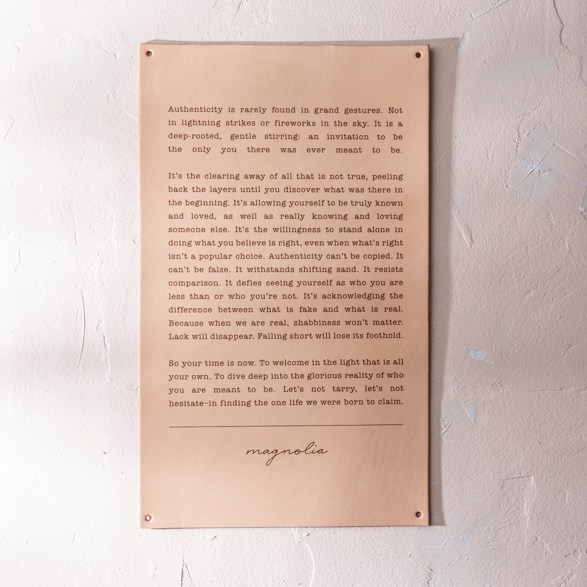 light leather sign with excerpt from Magnoliass spring 2019 journal about authenticity