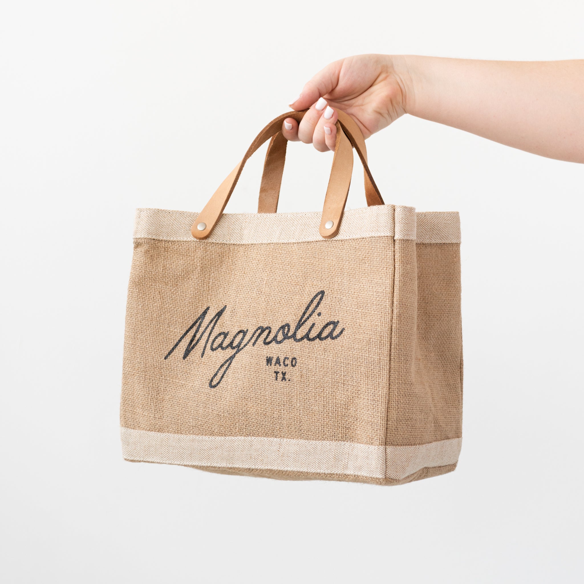 burlap tote with leather handles with Magnoliass script logo