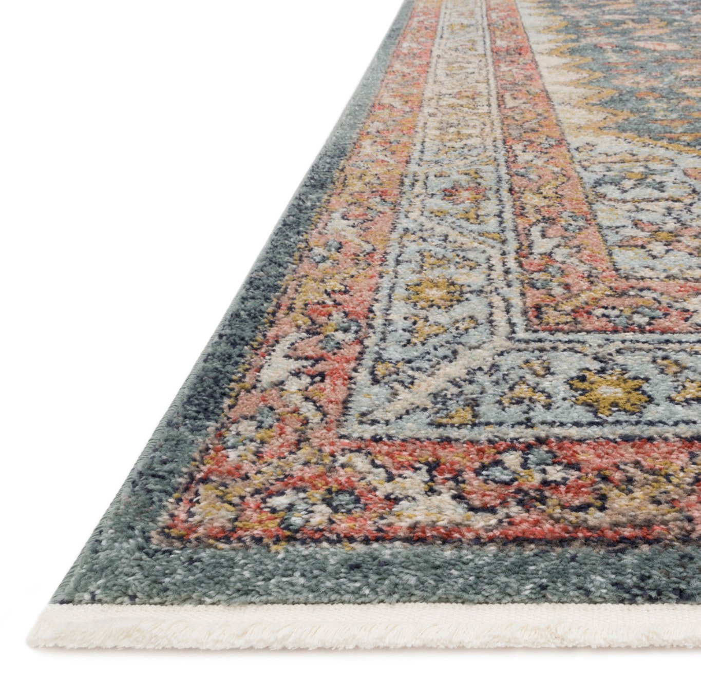 slate blue rug with persimmon edge detail