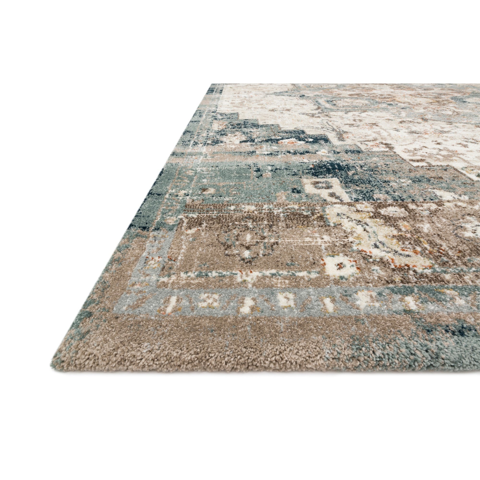 dark blue and cream area rug with varying floral detail