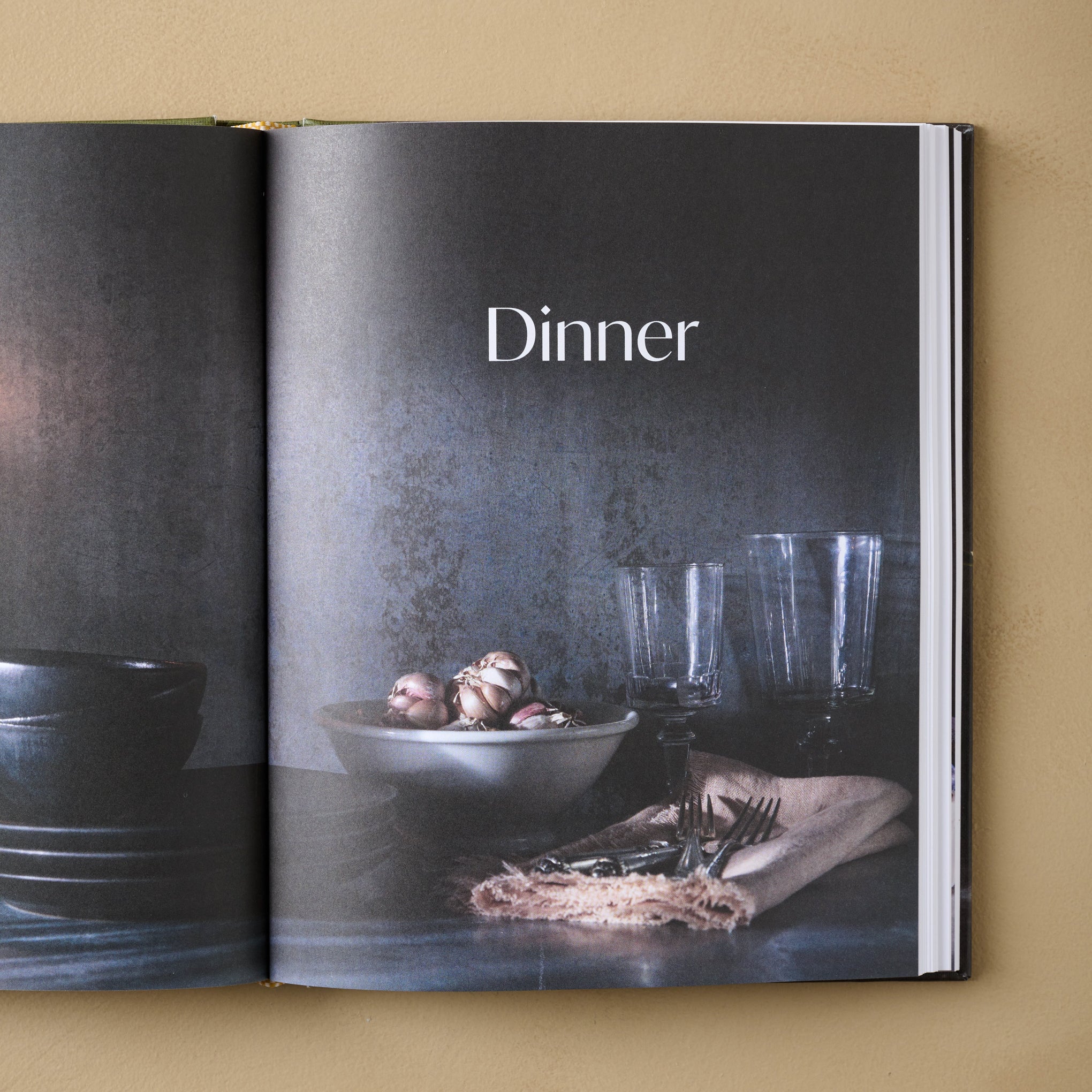 Joanna Gaines Magnoliass Table Cookbook Volume 3 open to a page titled dinner